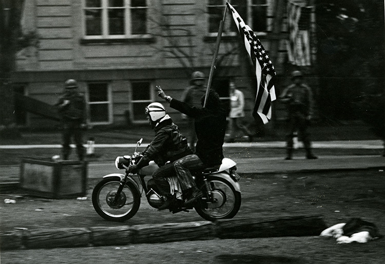 Woodstock West, students, motorcycle, American Flag
